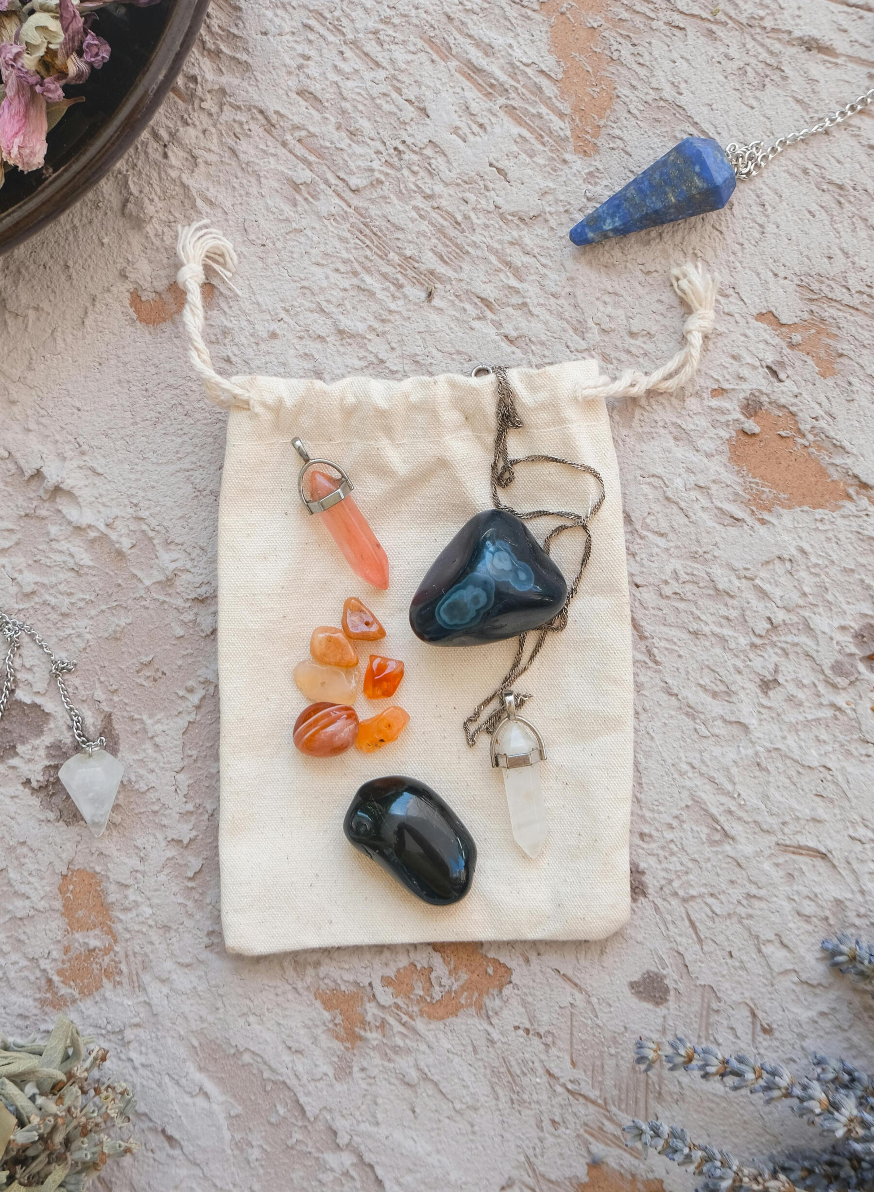 Healing crystals This is a photo of some crystals and two crystal pendulums